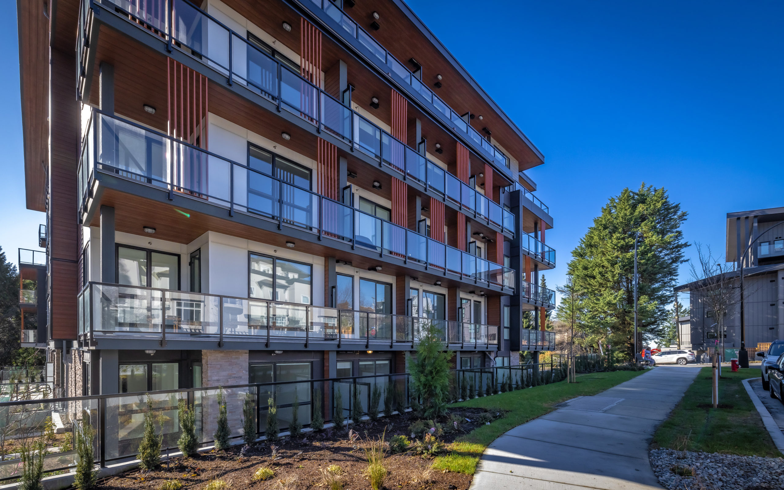 AXIR residential tower at dusk in North Vancouver